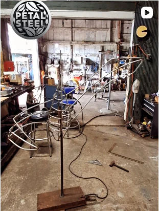 Early armature for the crane sculpture in the workshop.